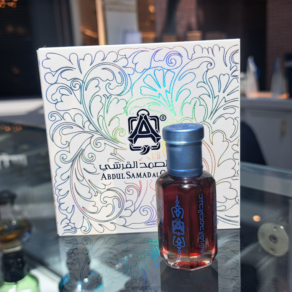 Unisex Royal Jasmine Oil by Abdul Samad Al Qurashi perfume brand, shown in a sleek body oil bottle with floral accents.
