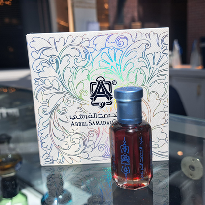 Unisex Royal Jasmine Oil by Abdul Samad Al Qurashi perfume brand, shown in a sleek body oil bottle with floral accents.